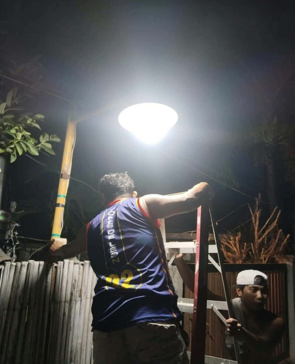 New streetlight lit up at night